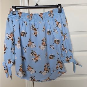 Blue off-shoulder shirt with flower prints